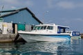 MALE, MALDIVES Ã¢â¬â November, 2017: Powerboat, standing at the pier near fresh fruit market, Male, Maldives